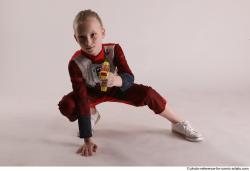 DENISA SITTING POSE WITH GUN